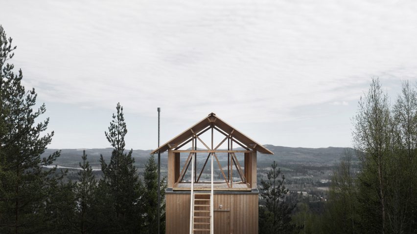 Timber-framed cabin by Hanna Michelson stands on stilts to peep over the treetops of Swedish mountain