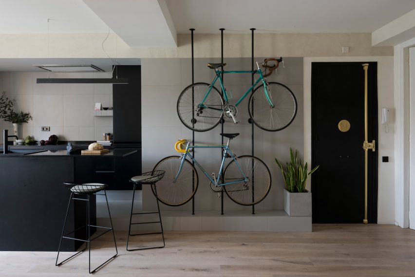 Bespoke storage creates room for bicycles in renovated Barcelona flat