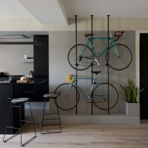 Bespoke storage creates room for bicycles in renovated Barcelona flat