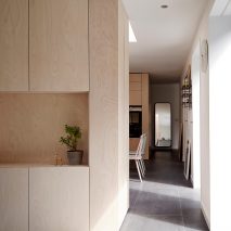 31/44 Architects builds grey-brick house around three small courtyards in London