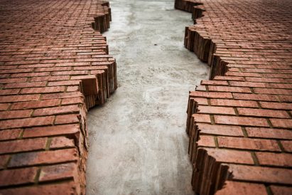 Six Pins and Half a Dozen Needles by Alex Chinneck