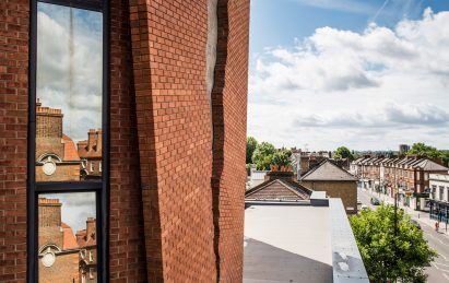 Six Pins and Half a Dozen Needles by Alex Chinneck