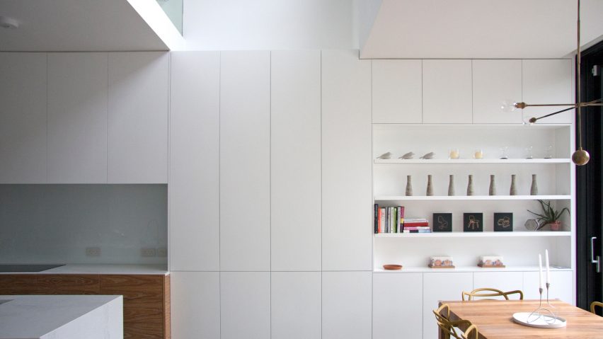 Shelving units and concealed doors compartmentalise refurbished London home