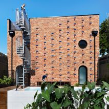 Austin Maynard Architects builds recycled-brick house on top of former Melbourne garage