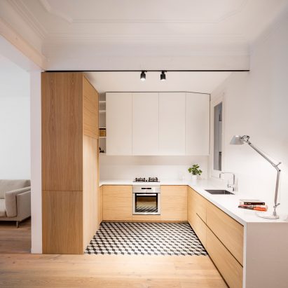 Adrian Elizalde and Clara Ocaña eschew tiles for timber in Barcelona apartment renovation