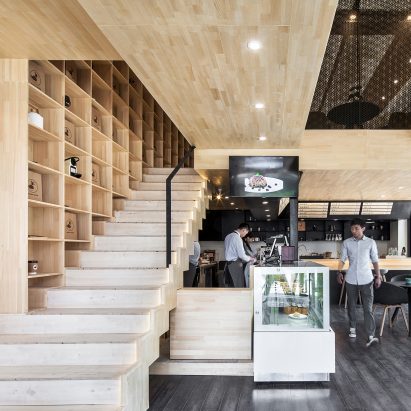 Chengdu coffee shop features a staircase that extends out of a bookcase