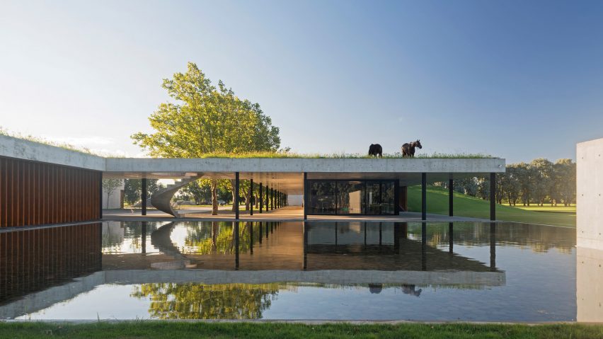 Polo stables by Estudio Ramos features grassy roof for horses to graze