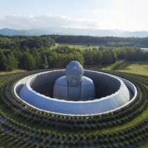 Tadao Ando surrounds huge buddha statue with lavender-covered mound at Sapporo cemetery