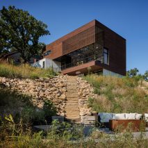 Kem Studio wraps lakeside Missouri residence in cypress and white stucco