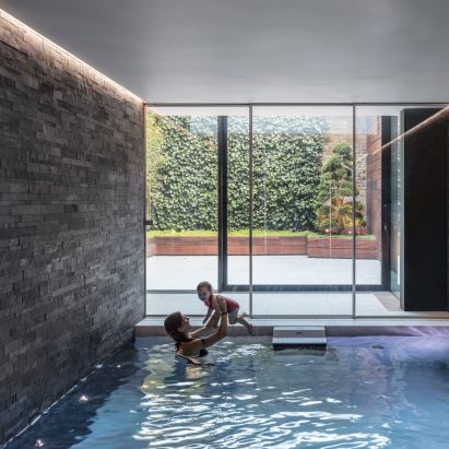 Glass box defines extension with basement pool for Victorian home in south London