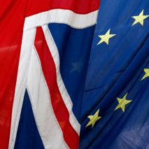 European Union and UK flags fly together.
