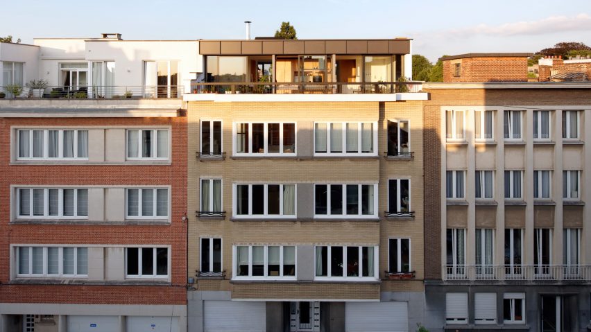 Alvar Aalto inspires orange blockwork fireplace in Notan Office’s Brussels roof extension