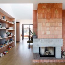 Alvar Aalto inspires orange blockwork fireplace in Notan Office’s Brussels roof extension