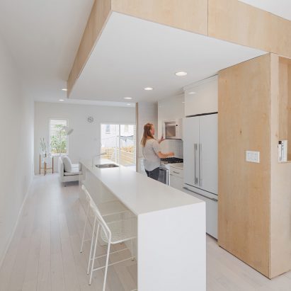 Plywood staircase extends up through centre of Philadelphia townhouse by ISA