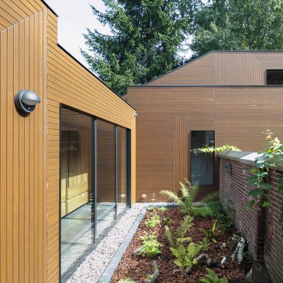 Ancient monastery wall slices through Utrecht house extension