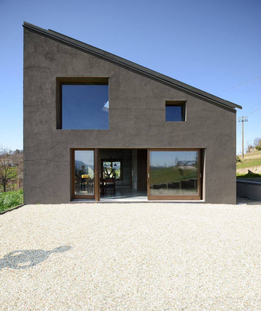 House R by 35a Studio is a concrete holiday home with a twisted roof