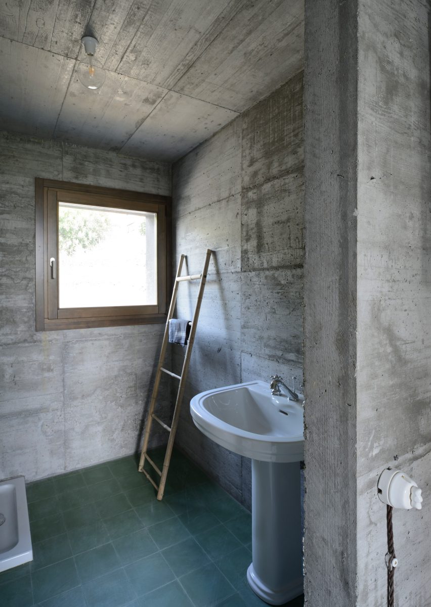 House R by 35a Studio is a concrete holiday home with a twisted roof