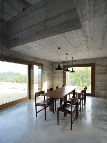 House R by 35a Studio is a concrete holiday home with a twisted roof