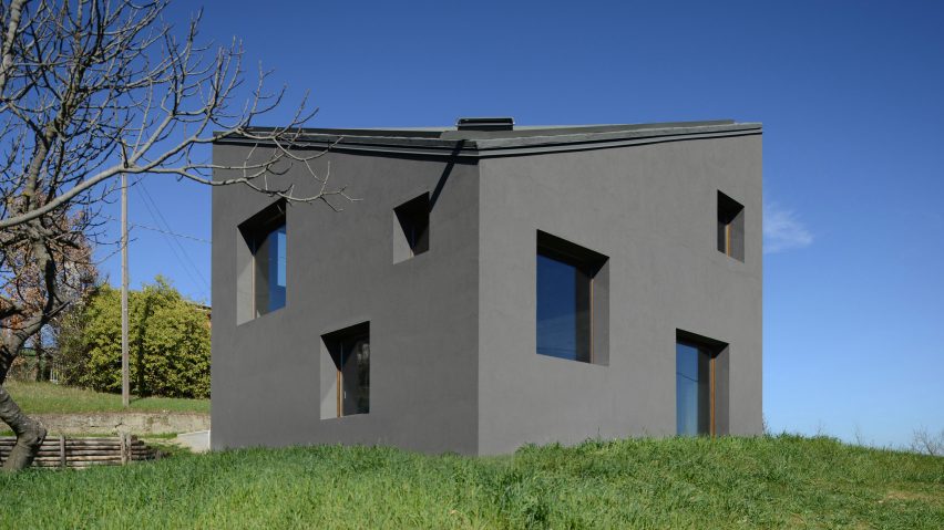 House R by 35a Studio is a concrete holiday home with a twisted roof