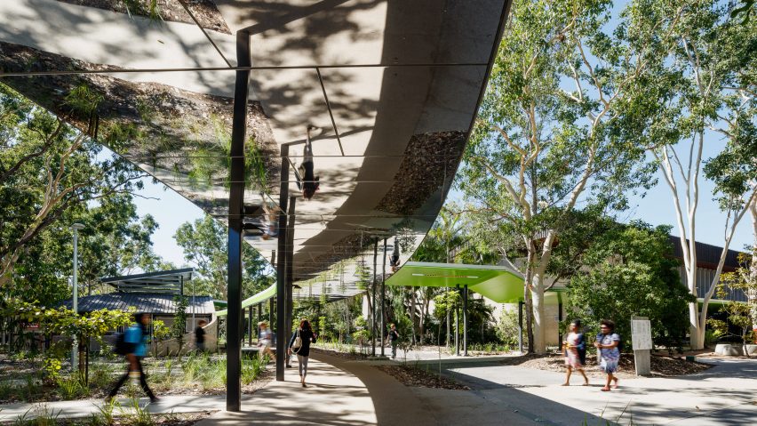 Mirrored ceilings reflect surroundings along walkway installed at Australian university campus