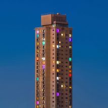Residents of Sydney high-rise estate use lights to protest against gentrification