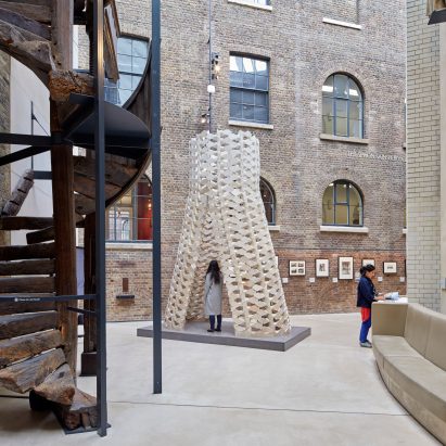 AAU Anastas stacks robotically cut stone blocks into tower at V&A