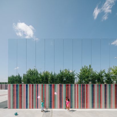 Mirrored panels and stripy tiles cover walls of Spanish school by ABLM Arquitectos