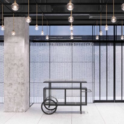 Neri&Hu uses translucent glass blocks for walls of bright and flexible function room in Beijing