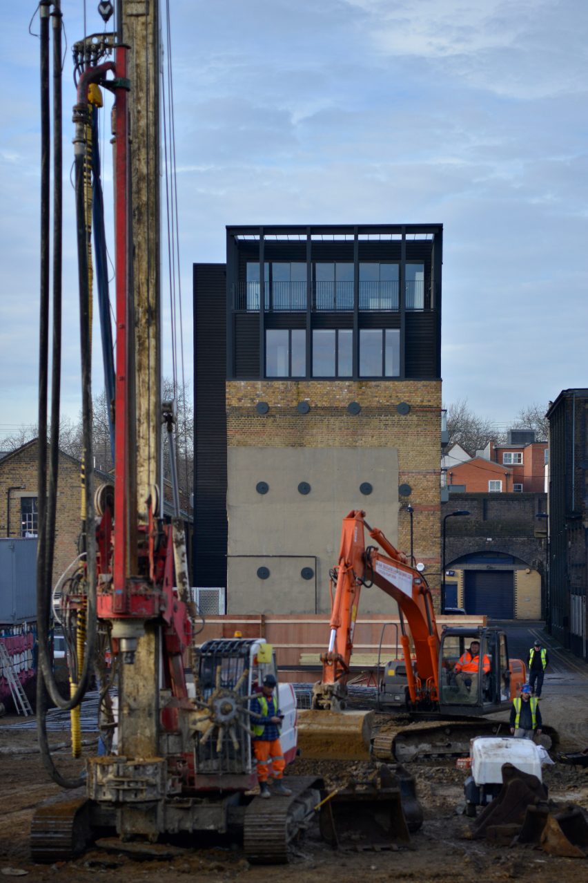 Simon Conder Associates has placed an extension clad in black-stained timber on top of a former warehouse in east London.
