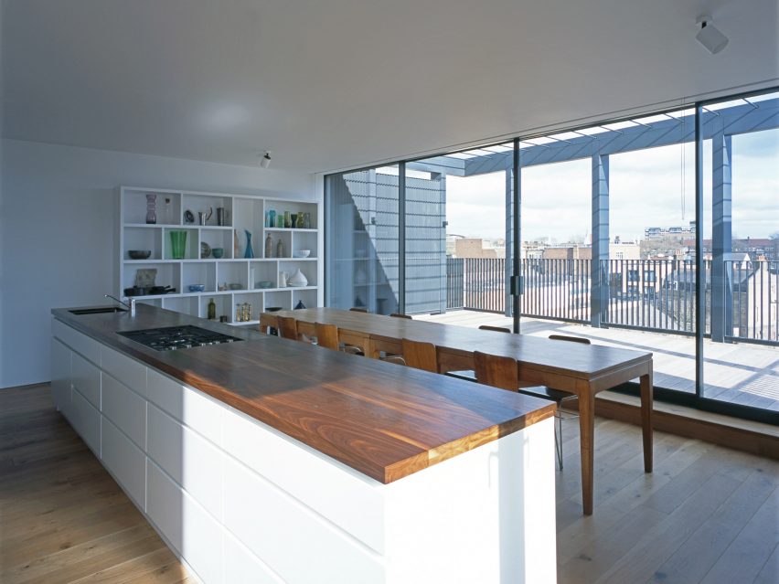 Simon Conder Associates has placed an extension clad in black-stained timber on top of a former warehouse in east London.