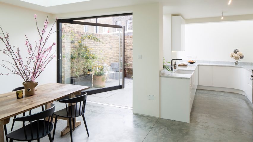 Giant pivoting door connects Columbia Road extension to secluded rear courtyard