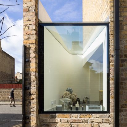 Giant pivoting door connects Columbia Road extension to secluded rear courtyard