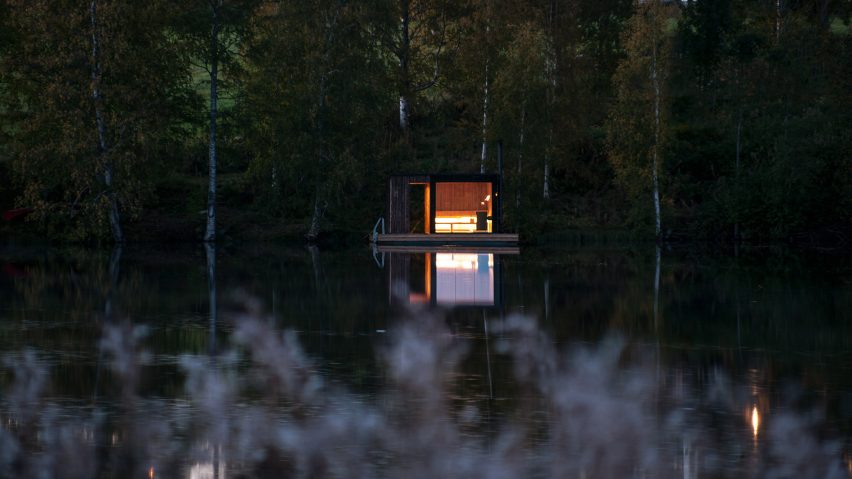Small Architecture Workshop’s charred-timber sauna floats on a Swedish lake