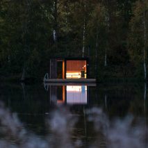 Small Architecture Workshop’s charred-timber sauna floats on a Swedish lake