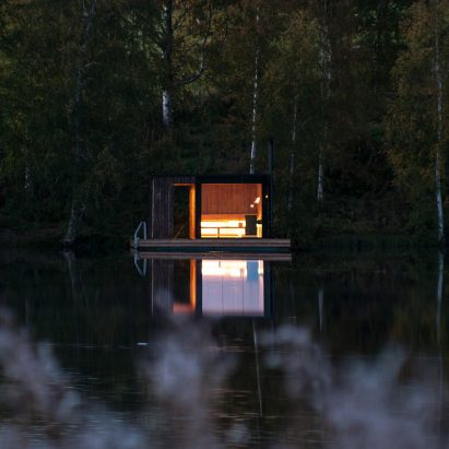Small Architecture Workshop’s charred-timber sauna floats on a Swedish lake