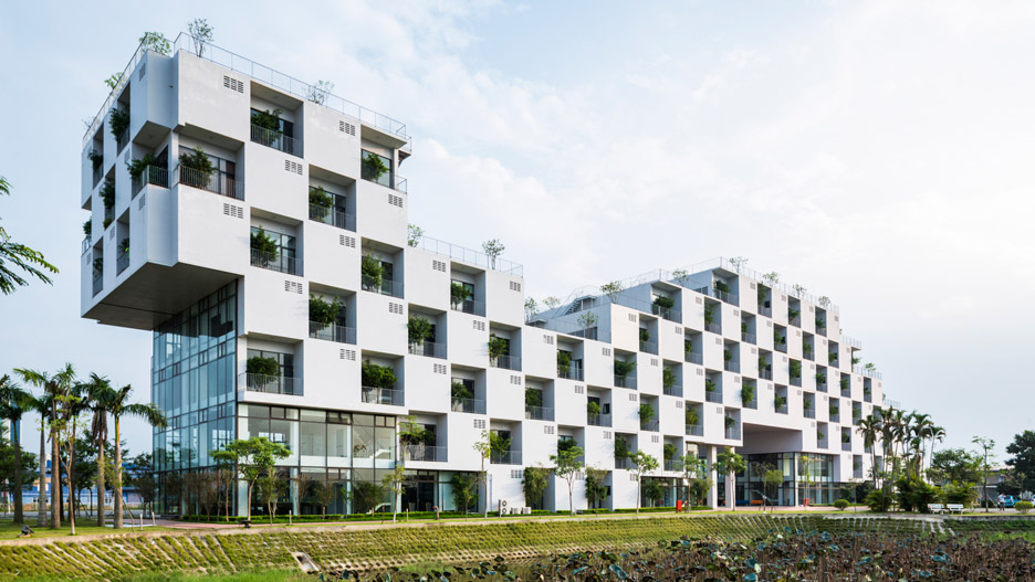 Vo Trong Nghia incorporates trees into chequerboard facade of Hanoi university building