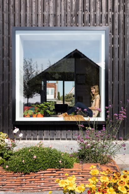 Dutch architect Chris Collaris has completed a house in Amsterdam clad entirely in blackened timber and featuring an asymmetric gabled roof.
