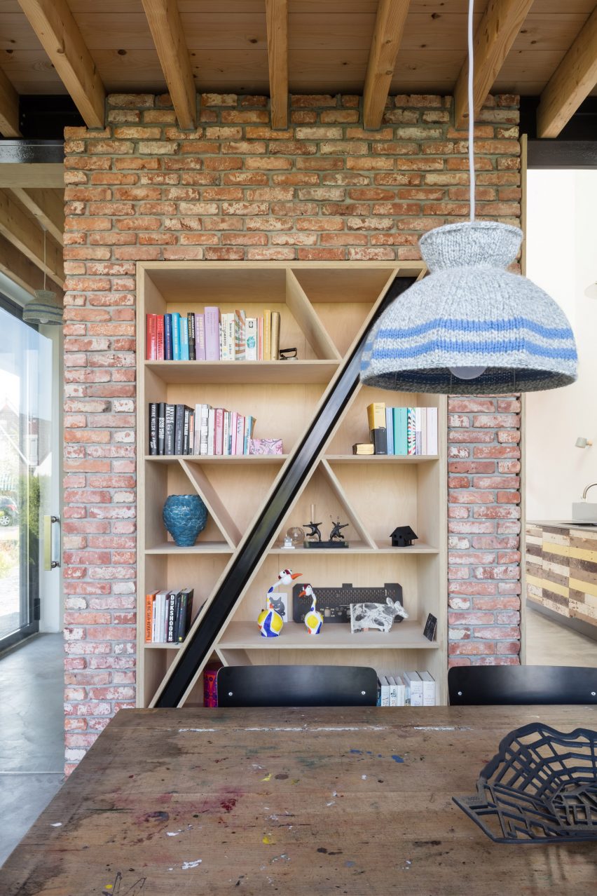 Dutch architect Chris Collaris has completed a house in Amsterdam clad entirely in blackened timber and featuring an asymmetric gabled roof.