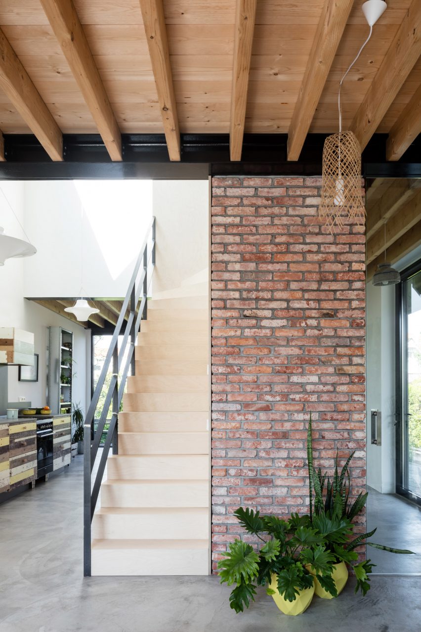 Dutch architect Chris Collaris has completed a house in Amsterdam clad entirely in blackened timber and featuring an asymmetric gabled roof.