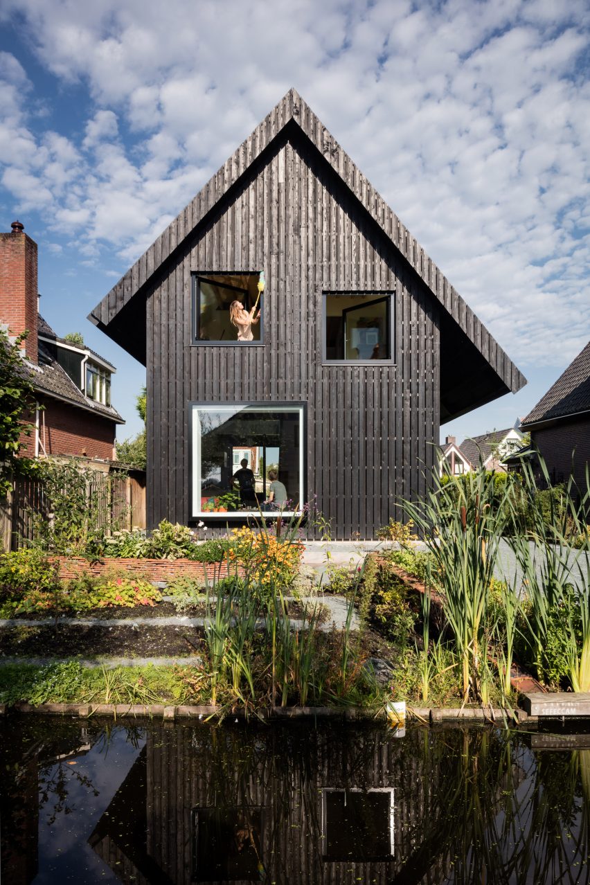 Dutch architect Chris Collaris has completed a house in Amsterdam clad entirely in blackened timber and featuring an asymmetric gabled roof.