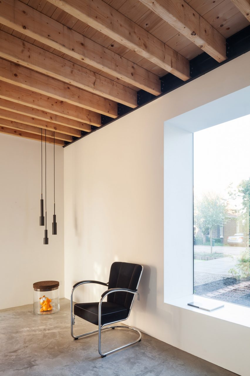 Dutch architect Chris Collaris has completed a house in Amsterdam clad entirely in blackened timber and featuring an asymmetric gabled roof.