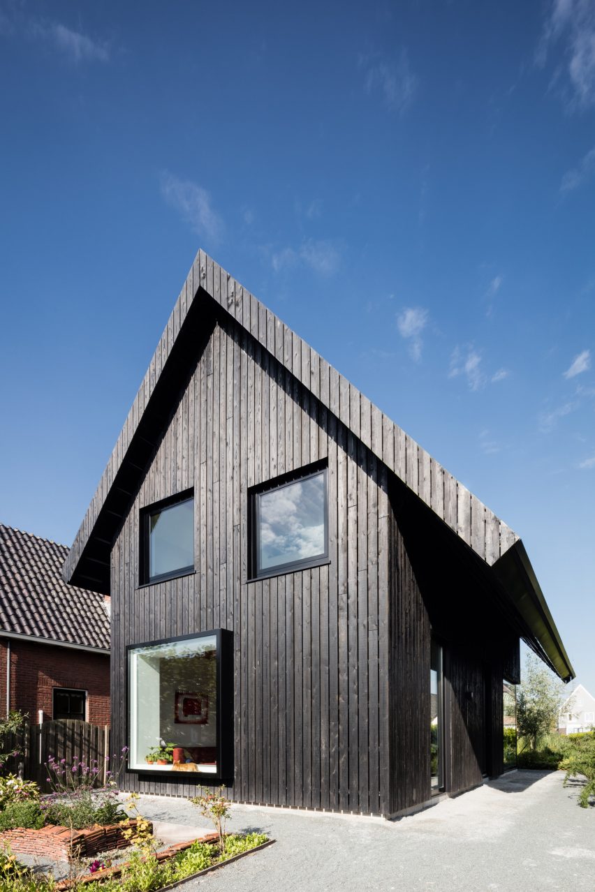 Dutch architect Chris Collaris has completed a house in Amsterdam clad entirely in blackened timber and featuring an asymmetric gabled roof.