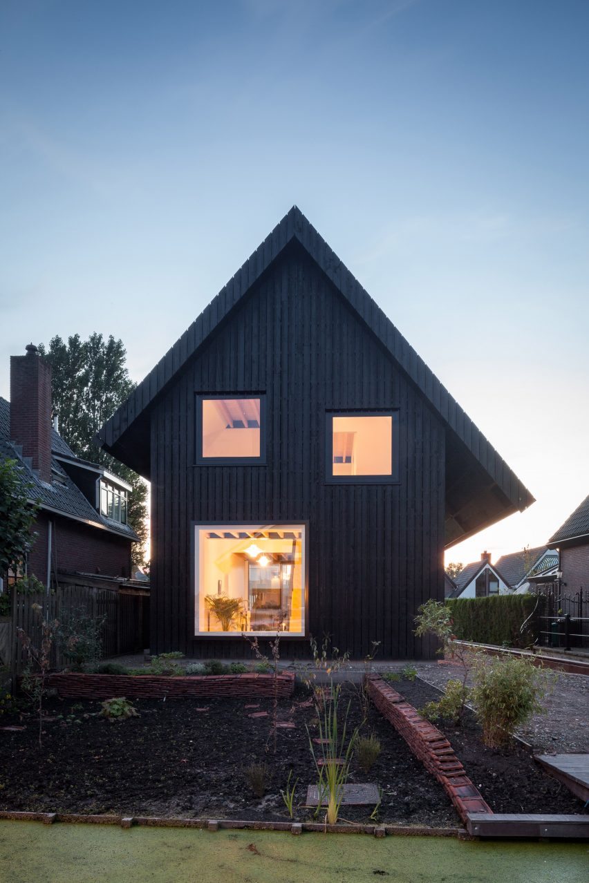 Dutch architect Chris Collaris has completed a house in Amsterdam clad entirely in blackened timber and featuring an asymmetric gabled roof.