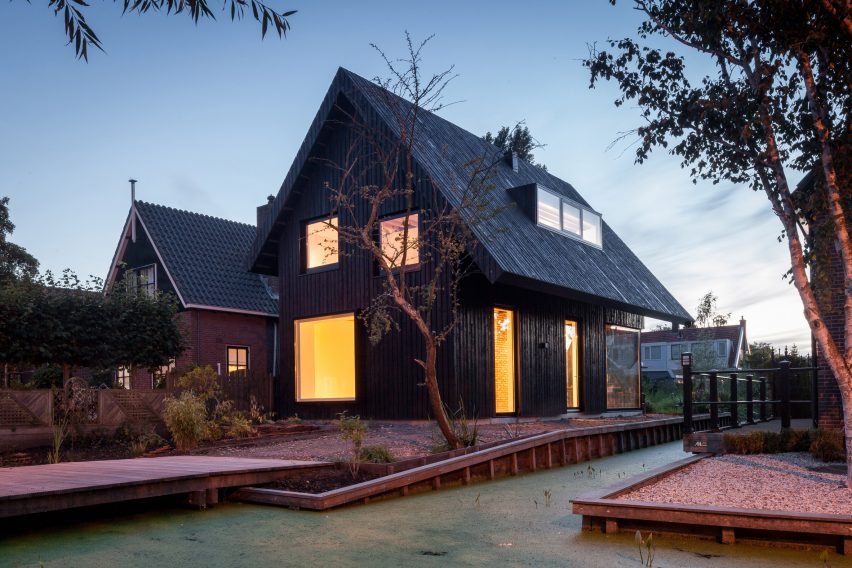 Dutch architect Chris Collaris has completed a house in Amsterdam clad entirely in blackened timber and featuring an asymmetric gabled roof.
