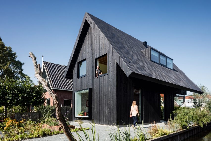 Dutch architect Chris Collaris has completed a house in Amsterdam clad entirely in blackened timber and featuring an asymmetric gabled roof.