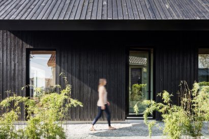 Dutch architect Chris Collaris has completed a house in Amsterdam clad entirely in blackened timber and featuring an asymmetric gabled roof.