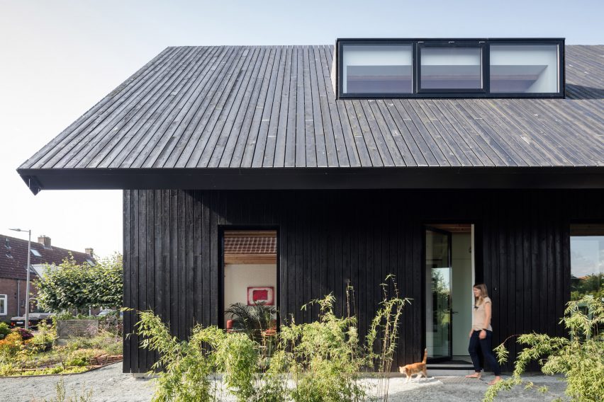 Dutch architect Chris Collaris has completed a house in Amsterdam clad entirely in blackened timber and featuring an asymmetric gabled roof.