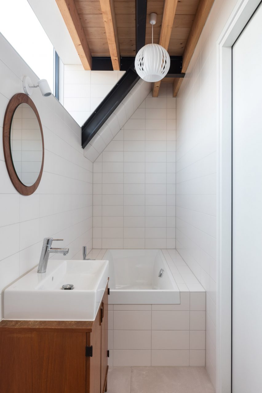 Dutch architect Chris Collaris has completed a house in Amsterdam clad entirely in blackened timber and featuring an asymmetric gabled roof.