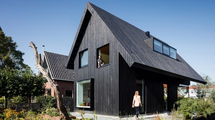 Dutch architect Chris Collaris has completed a house in Amsterdam clad entirely in blackened timber and featuring an asymmetric gabled roof.
