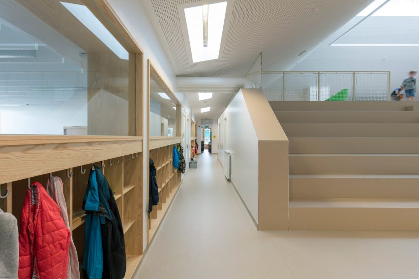 NL Architects completes Belgian school featuring low-lying rooms surrounded by a colonnade